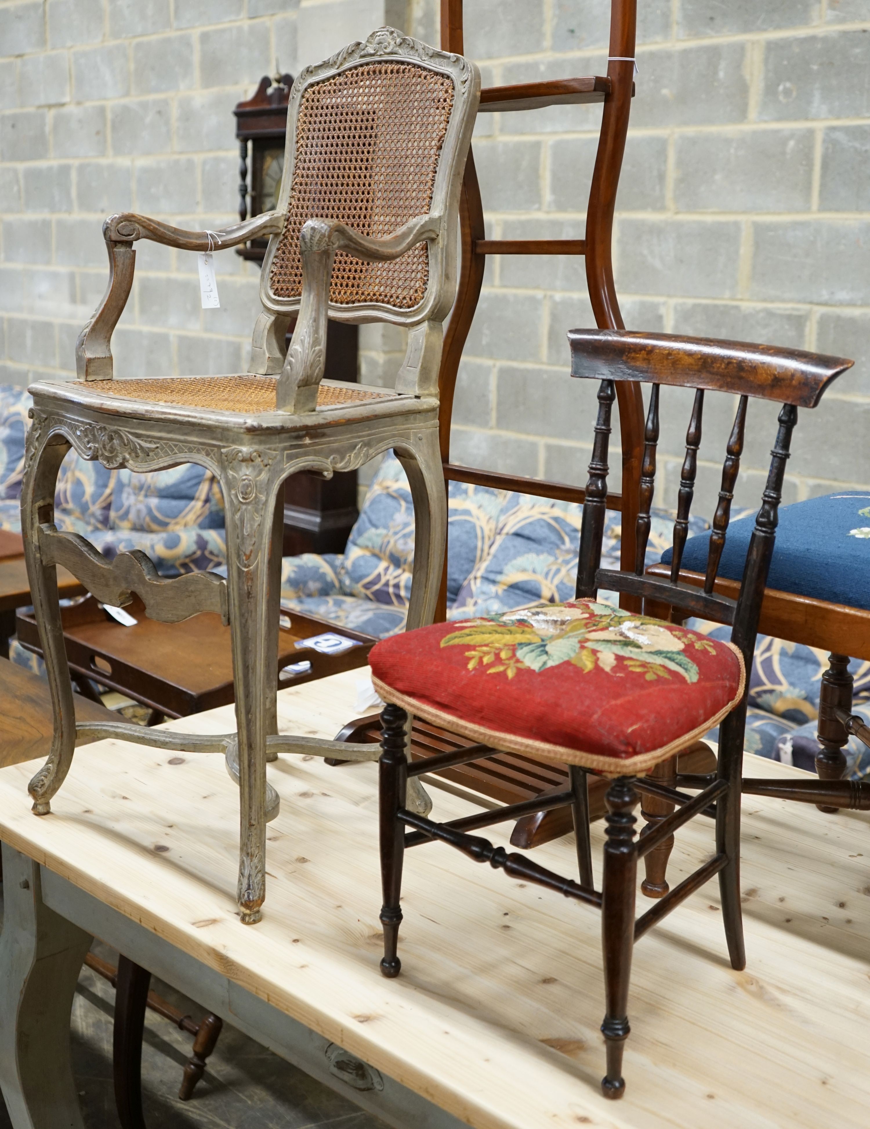 A Louis XVI design painted caned beech child's high chair together with a Victorian beech child's chair with remnants of a beadwork seat